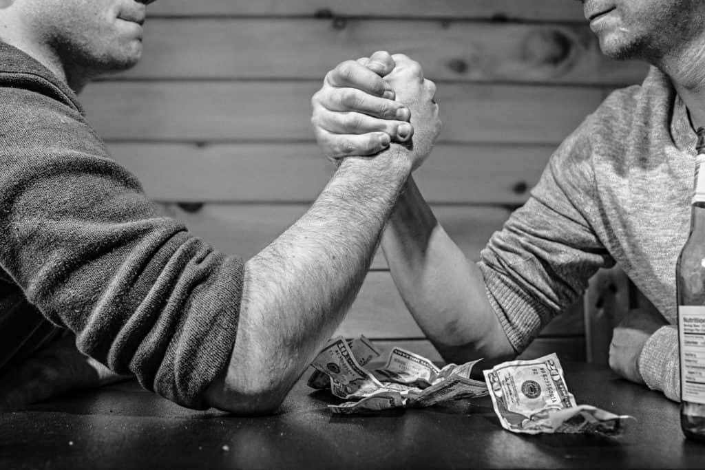 two people arm wrestling